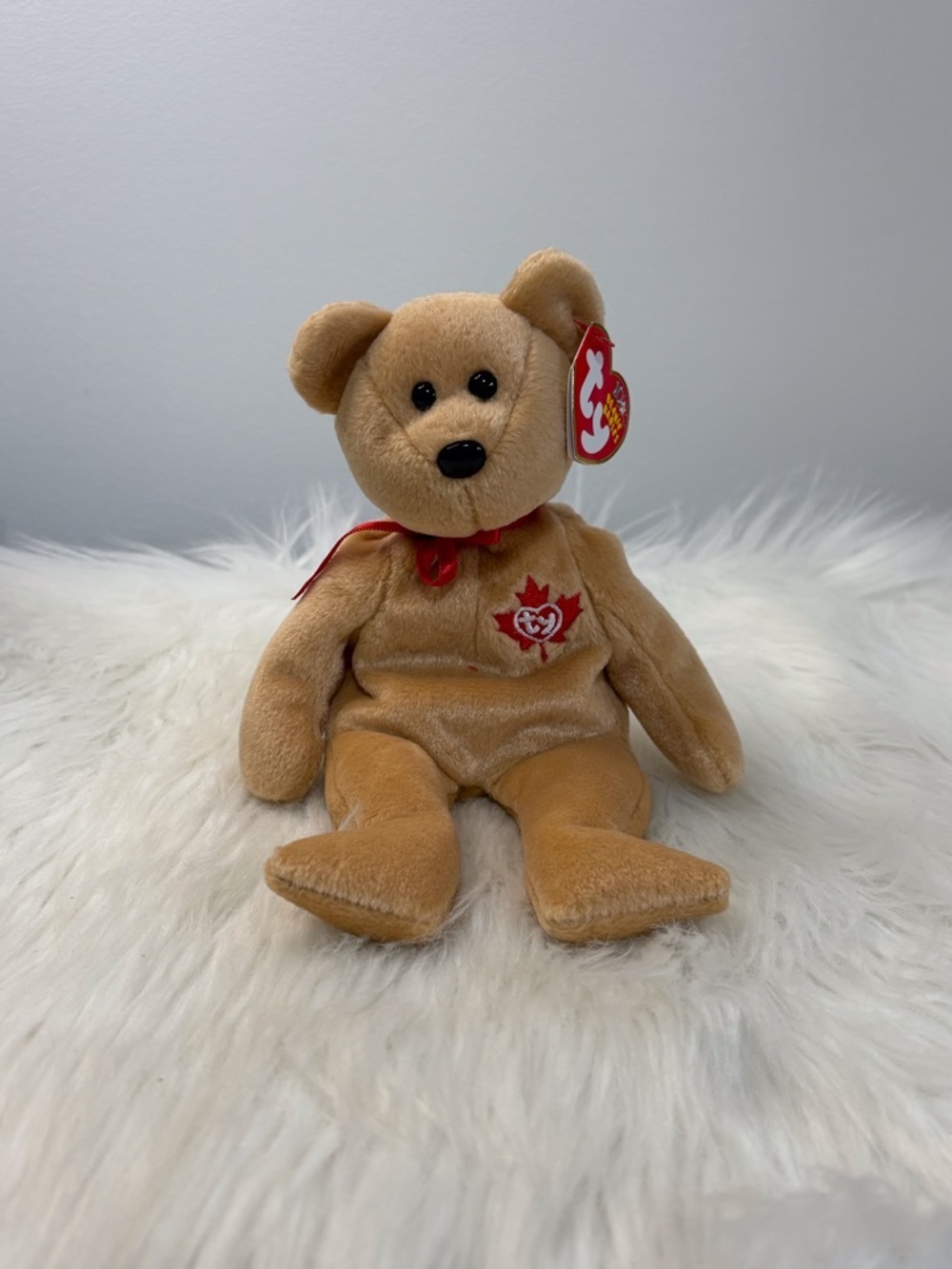 Ty(51)True Tan Bear with Red Maple Emblem and Ribbon